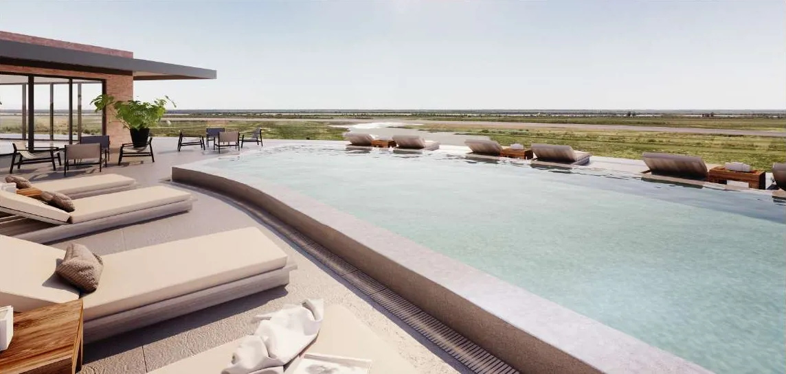 La pileta de la terraza, con reposeras y el río de fondo